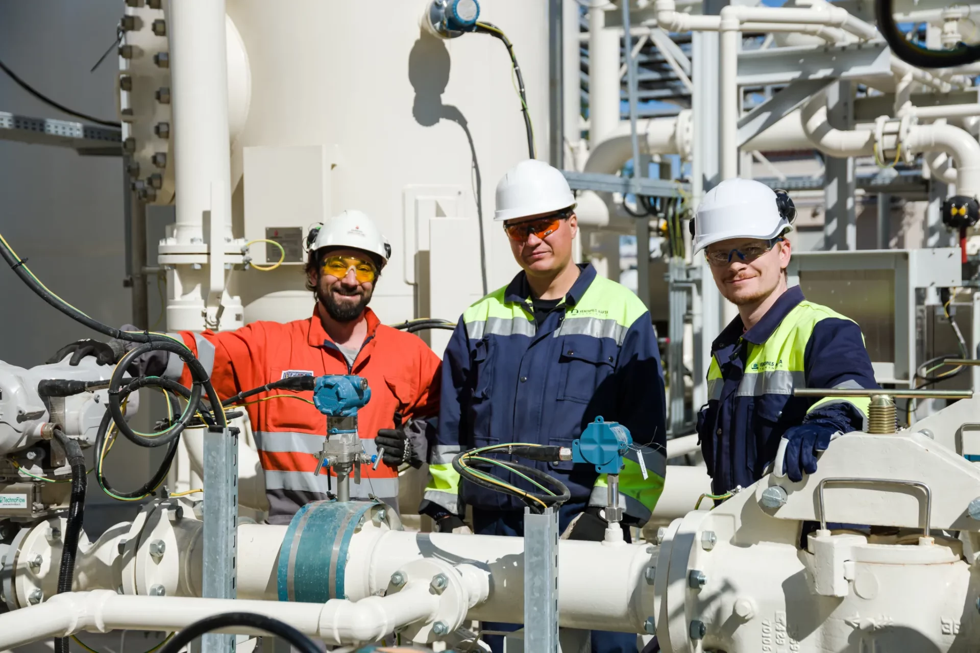 operators at work, smiling to camera